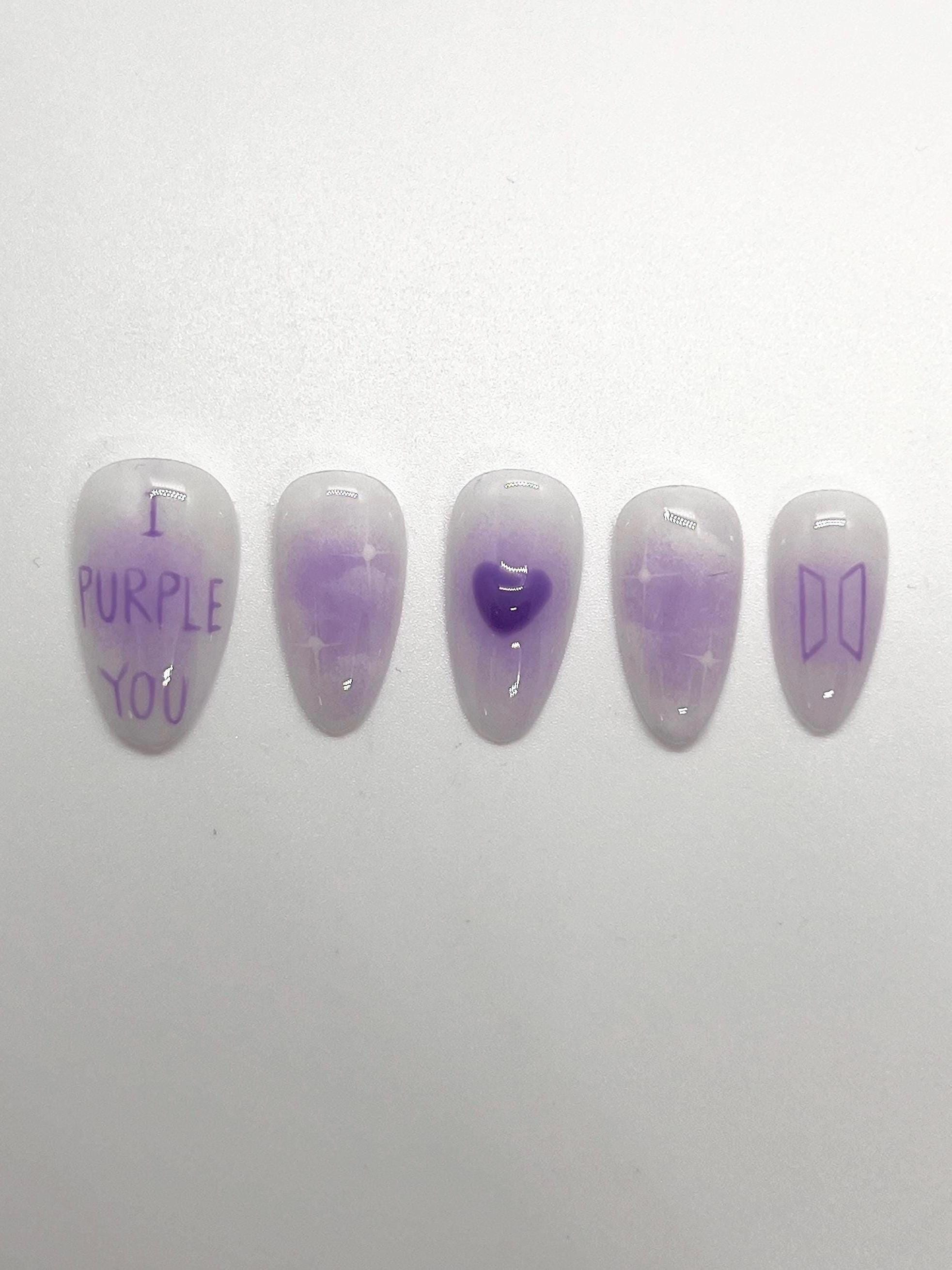This BTS-inspired handmade press-on nail set features purple and white gradient tones with elegant detailing, inspired by BTS’s signature purple. Designed to represent love, trust, and the lasting bond between artist and fans, these nails are perfect for ARMYs who want a subtle yet meaningful look.